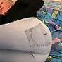 Teen honey pulls down her jeans to flash juicy ass