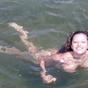 Talia goes skinny dipping and tans nude