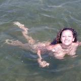 Talia goes skinny dipping and tans nude