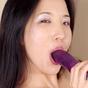 Almond having fun with her purple dildo