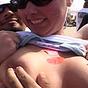 Blonde beachbabe flashing her titties