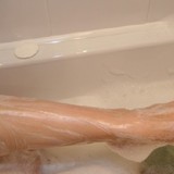 Big titted Indian in the bath shaving