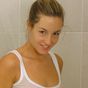 Melanie looking lovely as she gets in the shower in a tight top and cotton panties.