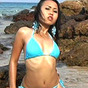 Baby blue Asian girl Joon in blue bikini plays in tide pool