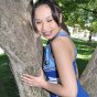 Naughty amateur asian cheerleader Sasha Yung showing her assets outdoors