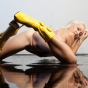 Janelle B rocks her yellow boots, soaks her body down, and cums from the water pressure beating against her pussy