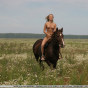 Gorgeous blonde rides a horse bare assed, revealing her hard nipples and ass for all occasions.