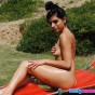 Kelly works on her tan while naked