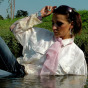 Crazy clothed lady loves swimming in a large pond