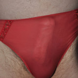 Hot red knickers covering a Pantie Boyz hard cock.