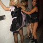 Two sexy blonde crossdressers posing at a fetish club