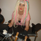 Naughty crossdresser with crazy hair wearing pink pvc