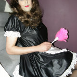 Crossdressing maid cleaning her house
