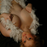 Ashley Ellison strips off and covers herself with feathers