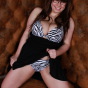 Big boobed babe squeezes her huge boobs into a tiny zebra print bikini