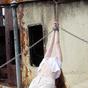 Gorgeous girl undressed and tied up on an old ship