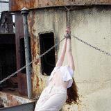 Gorgeous girl undressed and tied up on an old ship