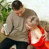A horny mature lady in black stockings does blowjob for a young beer-drinking guy
