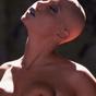 Bald girl in bustier shows off